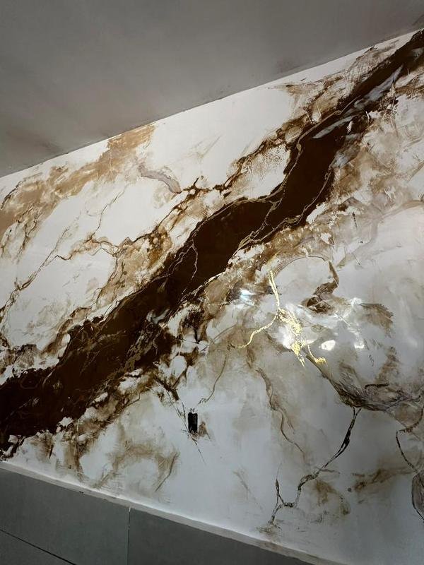 Efeito mármore Calacata Gold aplicado por aluno do método